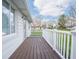 Covered front porch, painted white, offers space for outdoor relaxation at 4897 Walker St, Greenwood, IN 46143
