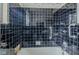 A tiled shower and tub combo in a retro bathroom, ready for updates at 5017 E 14Th St, Indianapolis, IN 46201
