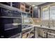 Kitchen is under construction with stainless double sink, gas stovetop, and black oven at 5017 E 14Th St, Indianapolis, IN 46201