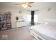 Spacious bedroom features a ceiling fan, a large dresser and decor at 5051 Arling Ct, Indianapolis, IN 46237