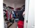 Walk-in closet with ample storage space, including shelving and hanging racks at 5051 Arling Ct, Indianapolis, IN 46237