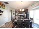 Dining room featuring a dark wood table, a view of kitchen, and light colored walls at 5051 Arling Ct, Indianapolis, IN 46237