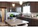 Well-lit kitchen featuring modern appliances, countertops, and an island for gathering at 5051 Arling Ct, Indianapolis, IN 46237