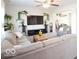 Open living room featuring a sectional sofa, a TV, and view of another room at 5051 Arling Ct, Indianapolis, IN 46237