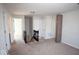 Bright loft area with neutral carpet, white walls, and a staircase leading to the lower level at 5051 Arling Ct, Indianapolis, IN 46237