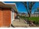 Back porch with brick siding, concrete tiles and a view of the backyard at 5124 Mccray St, Indianapolis, IN 46224