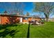 Large backyard with brick exterior and patio set at 5124 Mccray St, Indianapolis, IN 46224