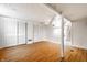 Unfinished basement area with laminate wood flooring, storage, white walls and walk-up stairs at 5124 Mccray St, Indianapolis, IN 46224