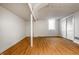 Spacious unfinished basement with laminate wood flooring, white walls, and window to allow natural light at 5124 Mccray St, Indianapolis, IN 46224