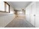 Spacious bedroom with neutral carpet, paneled walls, and ample natural light from the bright windows at 5124 Mccray St, Indianapolis, IN 46224