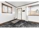 An entryway featuring a tiled floor and natural light coming in from a side and front window at 5124 Mccray St, Indianapolis, IN 46224