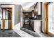 Updated kitchen features modern gray cabinetry and stainless steel appliances at 5124 Mccray St, Indianapolis, IN 46224