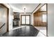 Tile floor, wood accents, and stainless-steel appliances are focal points of the renovated kitchen and dining area at 5124 Mccray St, Indianapolis, IN 46224