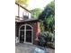 A backyard with a charming brick structure featuring an arched window and manicured landscaping at 5157 N New Jersey St, Indianapolis, IN 46205