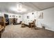 Spacious basement featuring a fireplace, wood furniture, and fitness equipment at 5157 N New Jersey St, Indianapolis, IN 46205