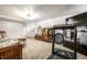 Spacious basement area with carpet, treadmill, and television at 5157 N New Jersey St, Indianapolis, IN 46205