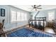 Serene bedroom features a large window, hardwood floors, and a decorative rug at 5157 N New Jersey St, Indianapolis, IN 46205