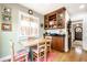 Bright breakfast nook featuring built-in cabinetry and open access to the rest of the home at 5157 N New Jersey St, Indianapolis, IN 46205