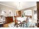 Elegant dining room featuring hardwood floors and an open view to the adjacent living room at 5157 N New Jersey St, Indianapolis, IN 46205