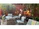 This outdoor patio offers an intimate setting with a brick wall mural and an attractive patio set at 5157 N New Jersey St, Indianapolis, IN 46205