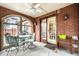 Screened in brick patio with furniture at 5157 N New Jersey St, Indianapolis, IN 46205