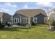 Expansive backyard with a patio, dining area, and lush green lawn perfect for outdoor living and entertaining at 5178 Aegis Dr, Noblesville, IN 46062
