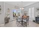 Bright dining area with a view to the backyard and access to outdoor fireplace at 5178 Aegis Dr, Noblesville, IN 46062