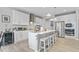 Bright kitchen featuring white cabinets, stainless steel appliances, a central island, and stylish pendant lighting at 5178 Aegis Dr, Noblesville, IN 46062