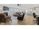 Spacious living room with fireplace, large windows, and comfortable seating at 5178 Aegis Dr, Noblesville, IN 46062