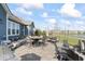Outdoor patio with lake view, string lights and dining area for enjoying outdoor gatherings near the water at 5178 Aegis Dr, Noblesville, IN 46062