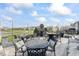 Inviting patio with comfortable seating, string lights, and a fire pit, perfect for enjoying evenings outdoors at 5178 Aegis Dr, Noblesville, IN 46062
