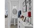 Well-lit powder room with a pedestal sink, decorative mirror, and elegant décor at 5178 Aegis Dr, Noblesville, IN 46062