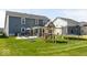 Large backyard featuring a playground, trampoline, and patio area at 5300 Veranda Dr, Noblesville, IN 46062