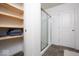 Storage shelves and a shower in a light and bright bathroom at 5300 Veranda Dr, Noblesville, IN 46062