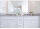 Modern bathroom with a double vanity featuring stone countertops and stylish fixtures at 5300 Veranda Dr, Noblesville, IN 46062