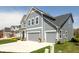 Beautiful two-story home showcasing a two-car garage, manicured lawn, and classic gray siding at 5300 Veranda Dr, Noblesville, IN 46062