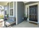 Charming front porch featuring comfortable seating and a stylish front door, creating a warm and inviting entrance at 5300 Veranda Dr, Noblesville, IN 46062