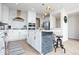 Stylish kitchen features white cabinets, stainless steel appliances, an island, and a decorative backsplash at 5300 Veranda Dr, Noblesville, IN 46062