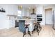 Bright kitchen with white cabinets, stainless steel appliances, gold accents, and a kitchen island at 5300 Veranda Dr, Noblesville, IN 46062