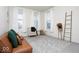 Cozy living room with soft carpet, a comfortable couch, and multiple windows that let in natural light at 5300 Veranda Dr, Noblesville, IN 46062