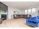 Bright living room featuring a fireplace, hardwood floors, and comfortable seating, creating a cozy atmosphere at 5300 Veranda Dr, Noblesville, IN 46062