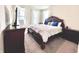 Bright main bedroom featuring a large bed, dresser, and plenty of natural light from the windows at 5300 Veranda Dr, Noblesville, IN 46062