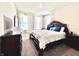 Spacious main bedroom featuring a large bed, dresser, and plenty of natural light from the windows at 5300 Veranda Dr, Noblesville, IN 46062