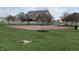 Community basketball court featuring a basketball hoop, walking paths, and green space at 5493 W Woodhaven Dr, McCordsville, IN 46055