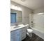 Cozy bathroom featuring a vanity with granite countertop and a shower/tub combo at 5493 W Woodhaven Dr, McCordsville, IN 46055
