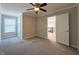 Bright bedroom with plush carpet and a doorway to a staircase at 5493 W Woodhaven Dr, McCordsville, IN 46055