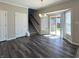 Dining area featuring luxury vinyl plank flooring, and a glass sliding door to the backyard at 5493 W Woodhaven Dr, McCordsville, IN 46055