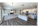Open kitchen layout featuring stainless steel appliances, granite countertops, and a convenient island at 5493 W Woodhaven Dr, McCordsville, IN 46055