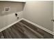 Empty laundry room with vinyl floors and washer/dryer hookups at 5493 W Woodhaven Dr, McCordsville, IN 46055