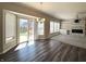 Bright living room featuring modern flooring, and a stone fireplace with custom built-ins at 5493 W Woodhaven Dr, McCordsville, IN 46055